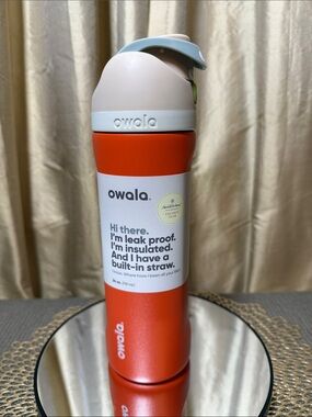 Owala 24 oz. Insulated Straw Bottle in Orange and Tan color